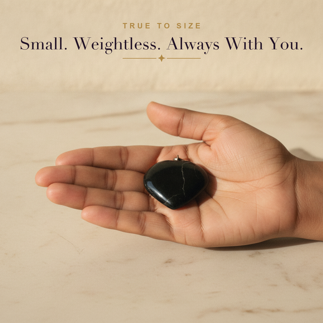 Black Tourmaline Heart Pendant — size in hand